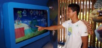 Tela interativa Ambientes Marinhos com jogos para conscientizar sobre a conservação marinha.