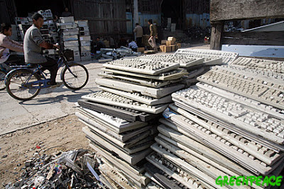 6 JAN 2007- Nanyang, Guangdong, China -Stacks of discarded electronic waste on the roadside in the Chinese village of Nanyang. Much of modern electronic equipment contains toxic ingredients and as much as 4,000 tonnes of toxic e-waste is discarded every hour. Vast amounts are routinely and often illegally shipped as waste from Europe, USA and Japan to countries in Asia as it is easier and cheaper to dump the problem on poorer countries with lower environmental standards. Workers involved in dismantling e-waste are exposed to serious, environmental problems, danger and health hazards. © Natalie Behring/GreenpeaceEDITORIAL USE ONLY. NO ARCHIVING. NO RESALE. NO AFTER MARKET OR THIRD PARTY SALES. OK FOR ONLINE REPRO.